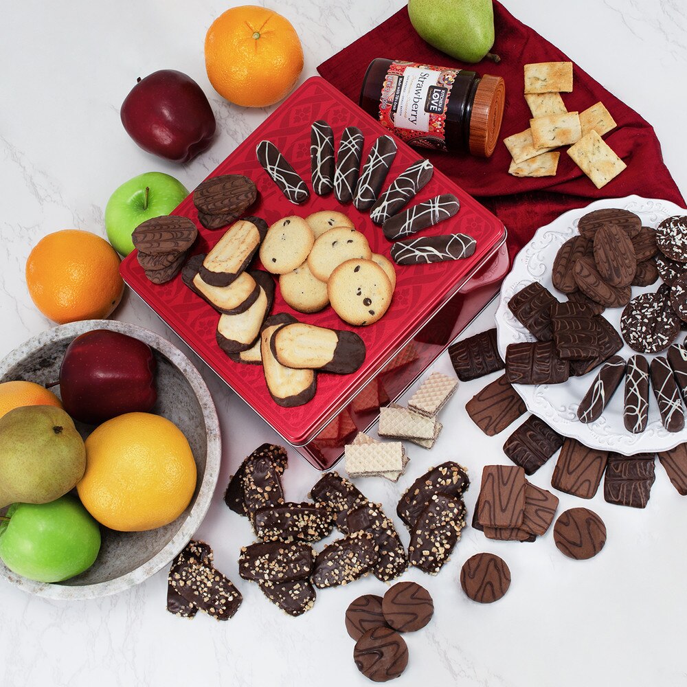 seven fruits with hazelnut in a brown bucket and red stripped ribbon